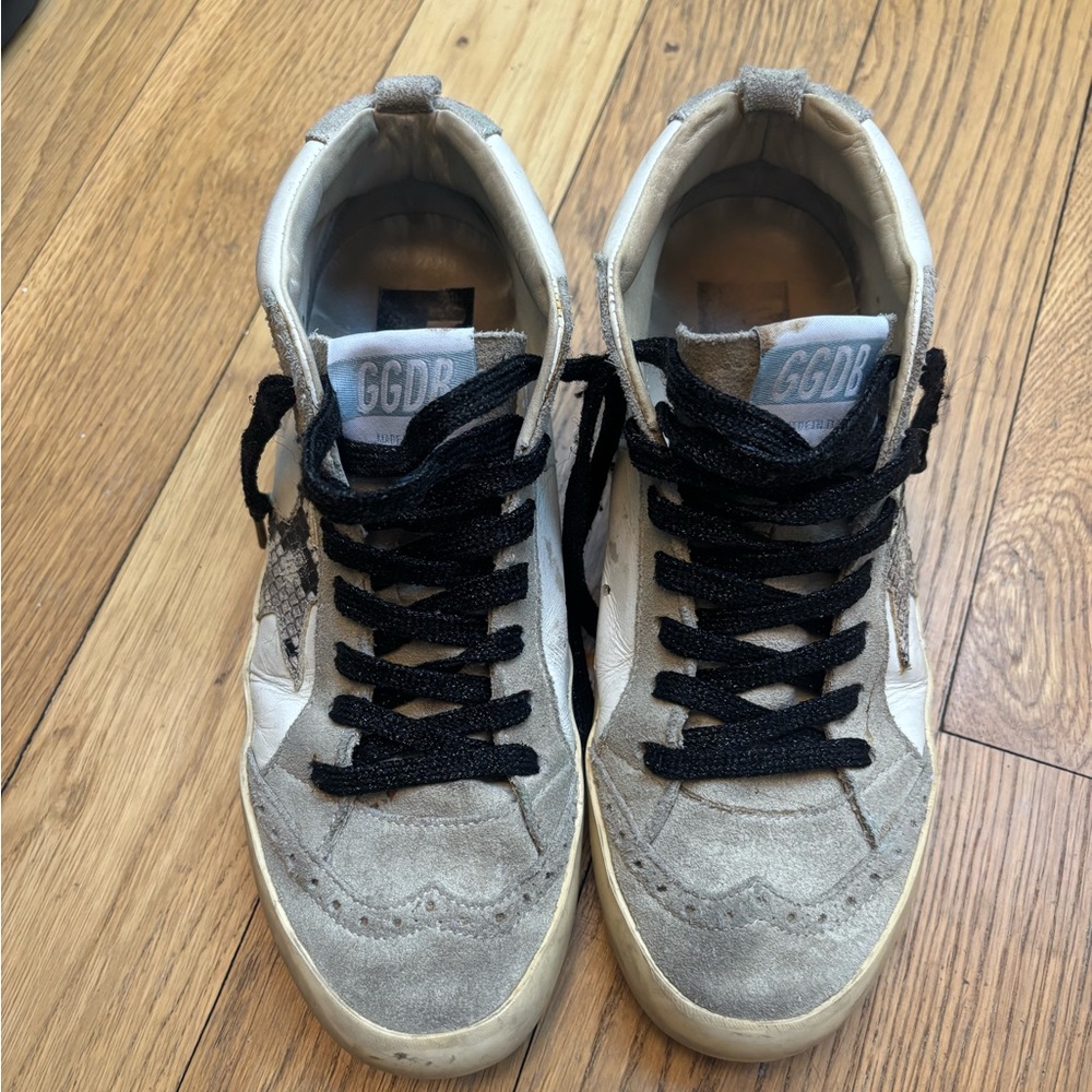 Golden Goose distressed grey sneaker with pink writing and silver sparkles